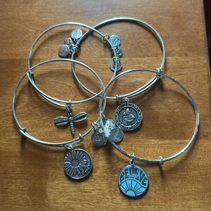 4 Alex and Ani Bracelets —-Elegant Silver Bracelet with Intricate Detailing.